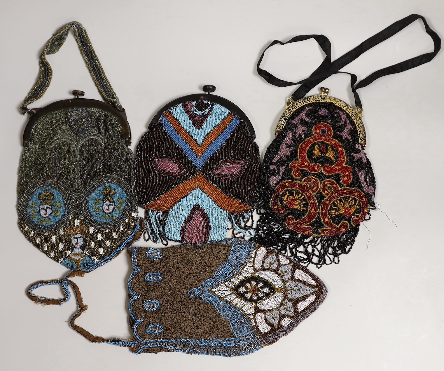 Two Edwardian bead worked bags and two later 1920’s beaded bags with Bakelite frames(4).